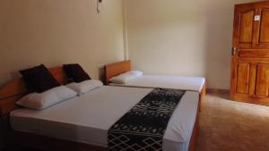 Katil atau katil-katil dalam bilik di Hotel Alas Garden