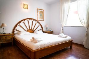 Postel nebo postele na pokoji v ubytování Duplex Rebeca FREE WIFI + 14 fotografií