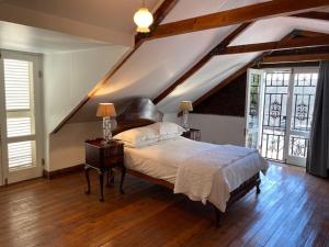 a bedroom with a bed and a wooden floor at The Prime Spot Self Catering in Worcester