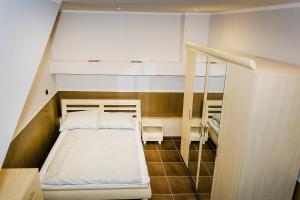 Ένα ή περισσότερα κρεβάτια σε δωμάτιο στο Apartament MICKIEWICZA