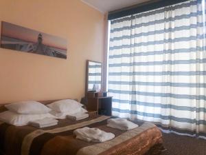 Postel nebo postele na pokoji v ubytování Hotel Yes