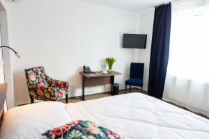 Letto o letti in una camera di Hotel Olympionik