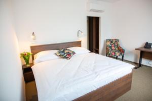 Letto o letti in una camera di Hotel Olympionik