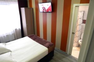 Vuode tai vuoteita majoituspaikassa Hotel Phenix