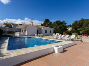 a swimming pool in front of a house at INNOUTHOME Gran casa con piscina Virgen Cinta II in L'Ametlla de Mar