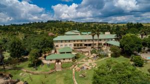 an aerial view of a large house with a garden at Gooderson Natal Spa Hot Springs Resort in Paulpietersburg