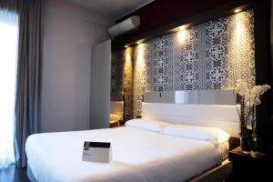 Postel nebo postele na pokoji v ubytování Hotel Palace