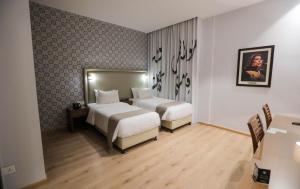 Voodi või voodid majutusasutuse La Locanda Boutique Hotel toas
