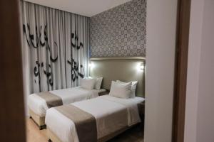 Voodi või voodid majutusasutuse La Locanda Boutique Hotel toas