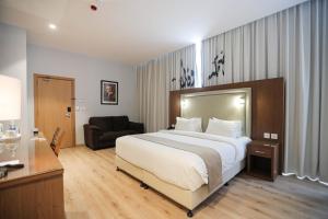 Voodi või voodid majutusasutuse La Locanda Boutique Hotel toas