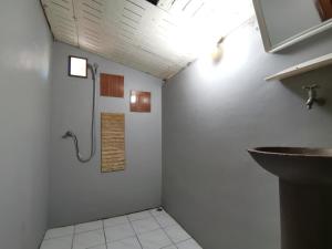 a bathroom with a shower and a sink in it at Sleep Whale Lanta in Ko Lanta