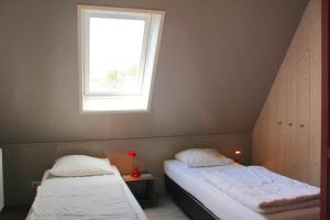 Postel nebo postele na pokoji v ubytování Sandy 25