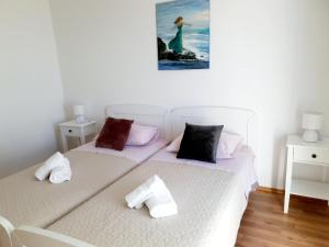 Postel nebo postele na pokoji v ubytování Apartman Šime