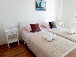 Postel nebo postele na pokoji v ubytování Apartman Šime