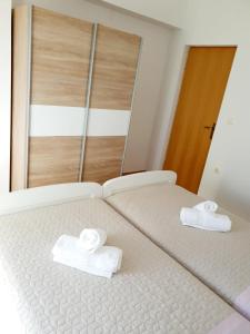 Postel nebo postele na pokoji v ubytování Apartman Šime
