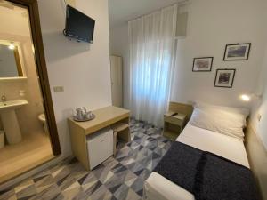 Postel nebo postele na pokoji v ubytování Giovanna Rooms + 5 fotografií