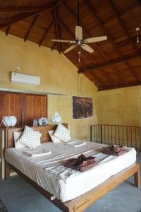 Een bed of bedden in een kamer bij Kitelantis Hotel and Resort