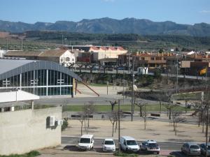 a city with cars parked in a parking lot at Hostal Fontdemora in Mora la Nueva