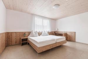 Aparthotel Wiggertal - Self Check-in tesisinde bir odada yatak veya yataklar