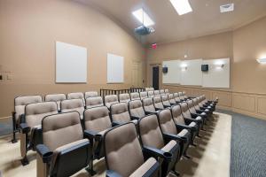 an empty lecture room with chairs and a podium at Spacious Home wPrivate PoolSpa & FREE Waterpark in Orlando +80 photos