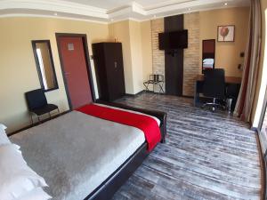 Кровать или кровати в номере Citystay Ladybrand