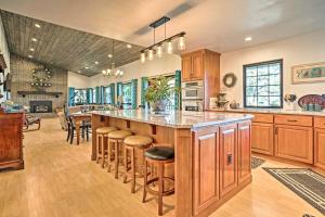 a large kitchen with a large island with bar stools at Mountain Escape - 7 Miles to Mission Ridge Resort! in Wenatchee