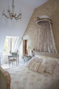Manoir de la Foulquetiere tesisinde bir odada yatak veya yataklar