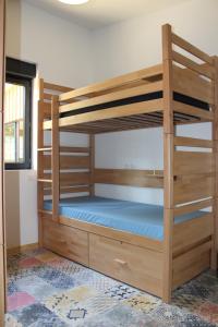 a bedroom with two bunk beds with blue sheets at Cheeky family in Lacanau-Océan