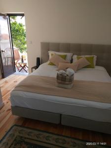 Ένα ή περισσότερα κρεβάτια σε δωμάτιο στο Oporto Glamour Suite House