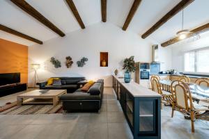 a living room with a couch and a table at Château Saint Martin de Graves in Aumes