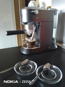 a coffee maker and spoons on a counter at Cihlarka 303 in Černý Dŭl +19 photos