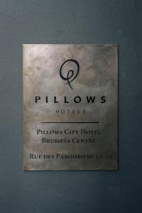 a sign that is on the side of a wall at Pillows City Hotel Brussels Centre in Brussels