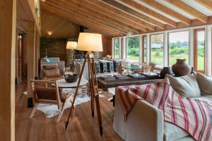 a living room with a table and a couch at Futangue Hotel & Spa in Lago Ranco