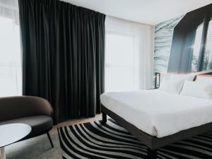 Cama ou camas em um quarto em Novotel Angers Centre Gare