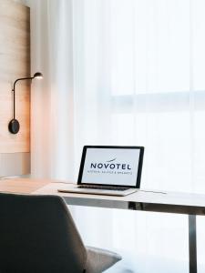 Cama ou camas em um quarto em Novotel Angers Centre Gare