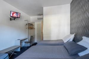 Rúm í herbergi á Hotel Rubino