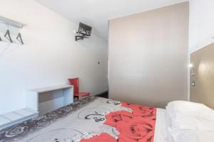 Rúm í herbergi á Hotel Rubino