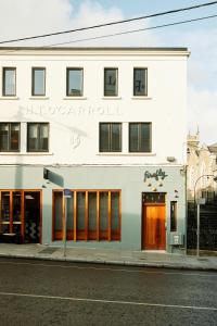 a white building on the side of a street at Firefly in Bray