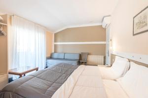 Rúm í herbergi á Hotel Rubino