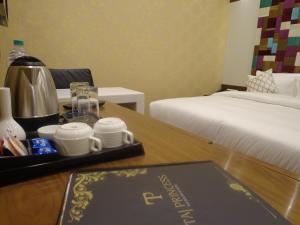 Postel nebo postele na pokoji v ubytování Hotel Taj Princess - Boutique Hotel