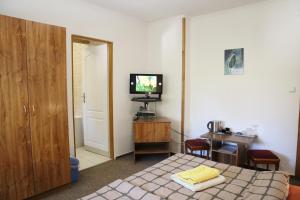 TV a/nebo společenská místnost v ubytování Hotel 66