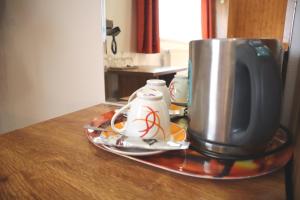 Příslušenství pro přípravu čaje a kávy v ubytování Hotel 66