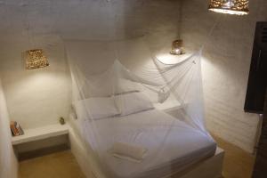 Postel nebo postele na pokoji v ubytování Esquina Lejana EcoLodge