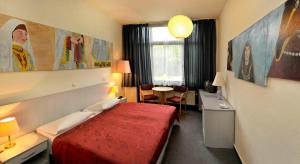 Postel nebo postele na pokoji v ubytování Berlin ART Hotel