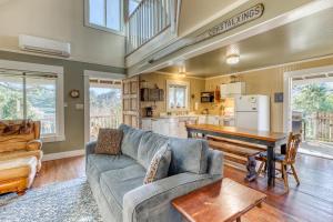 a living room with a couch and a table at Heceta House in Florence