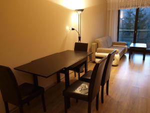 Posezení v ubytování Apartament Na Tęczowym Wzgórzu + 11 fotografií