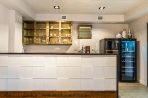 a kitchen with a counter and a refrigerator at Casa Néboa. in Negreira