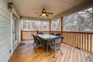 a screened in porch with a table and chairs on it at Alpine Retreat in Helen