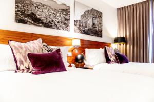Postel nebo postele na pokoji v ubytování HOTEL MINA REAL MATEHUALA