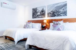 Postel nebo postele na pokoji v ubytování HOTEL MINA REAL MATEHUALA